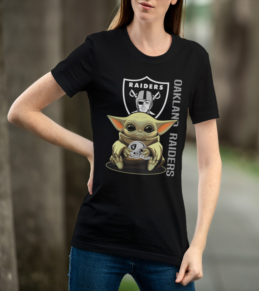 Baby Yoda Holding Oakland Raiders Helmet With Raiders Logo In Background T-Shirt