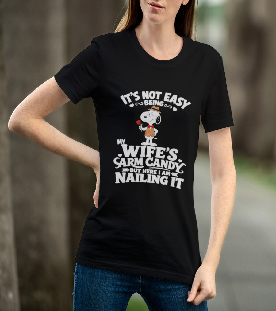 Snoopy It's Not Easy Being My Wife's Arm Candy But Here I Am Nailing It T-Shirt